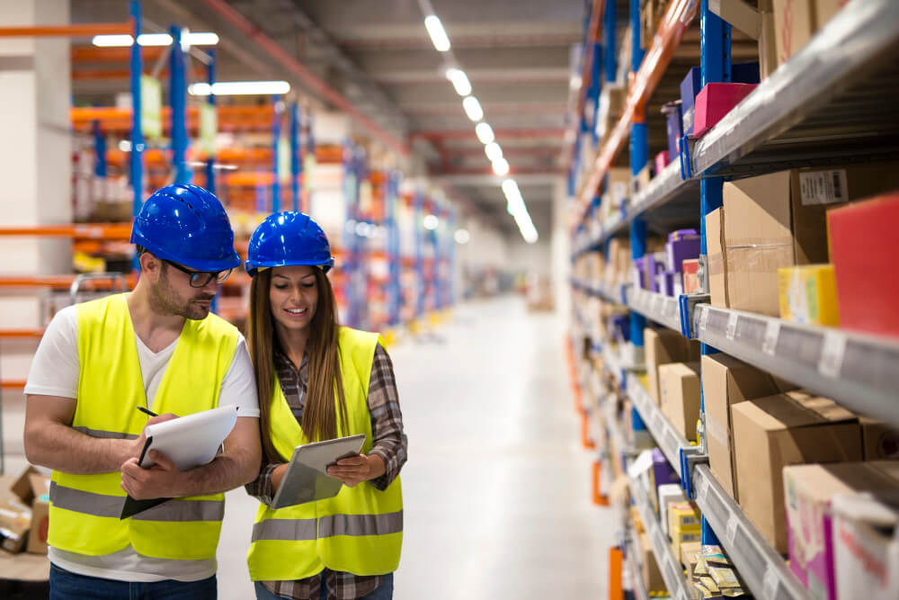 warehouse employees working together on counting products and checking inventory in storage center1